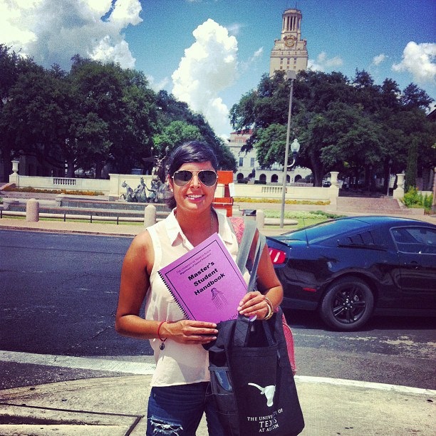 Master's student with UT Tower in the background