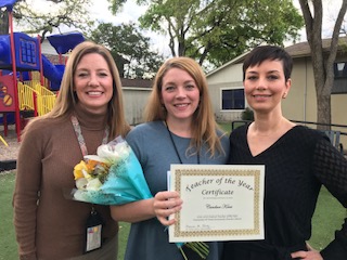 image of teachers with Candace, holing Teacher of the Year certificate