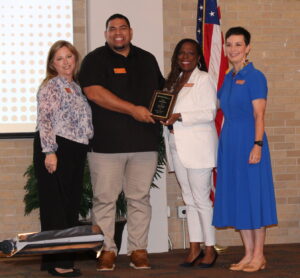 Coach Govea receives UT Charter Teacher of the Year award from Principal McMahon, Superintendent Whetstone and Executive Director Chavez