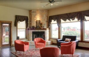 Group therapy room, showing five chairs in a room with a fireplace