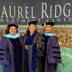 Doctors De La Cruz, Sacriste and Leal in graduate regalia