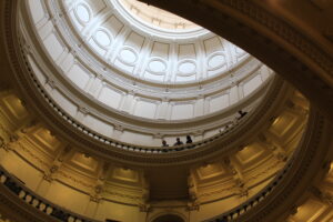 Teacher Ryan Butler at the top of the Capitol rotunda with Boysville students